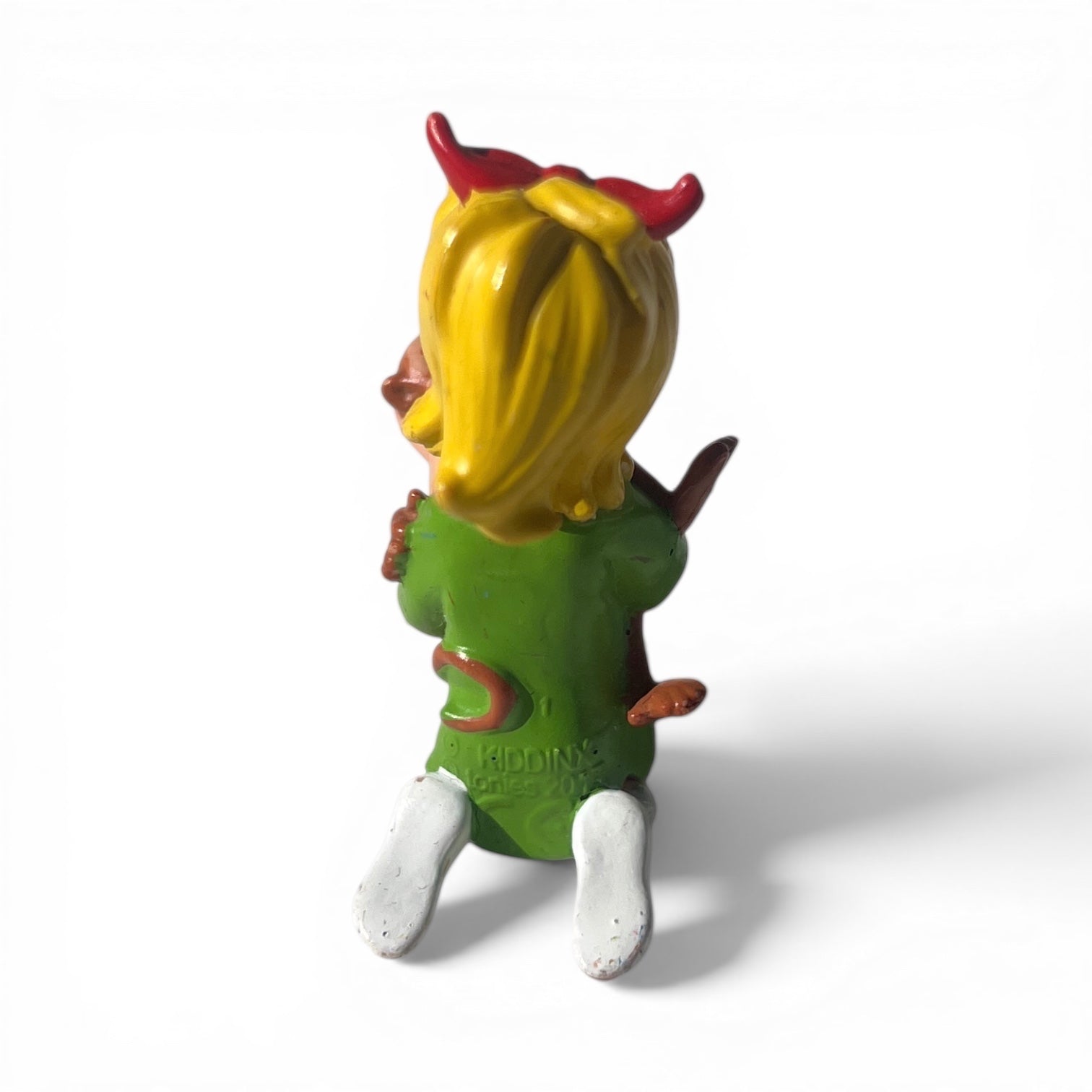 VideoGamePalace green devil figurine with yellow hair, red horns, and white shoes. Collectible toy.